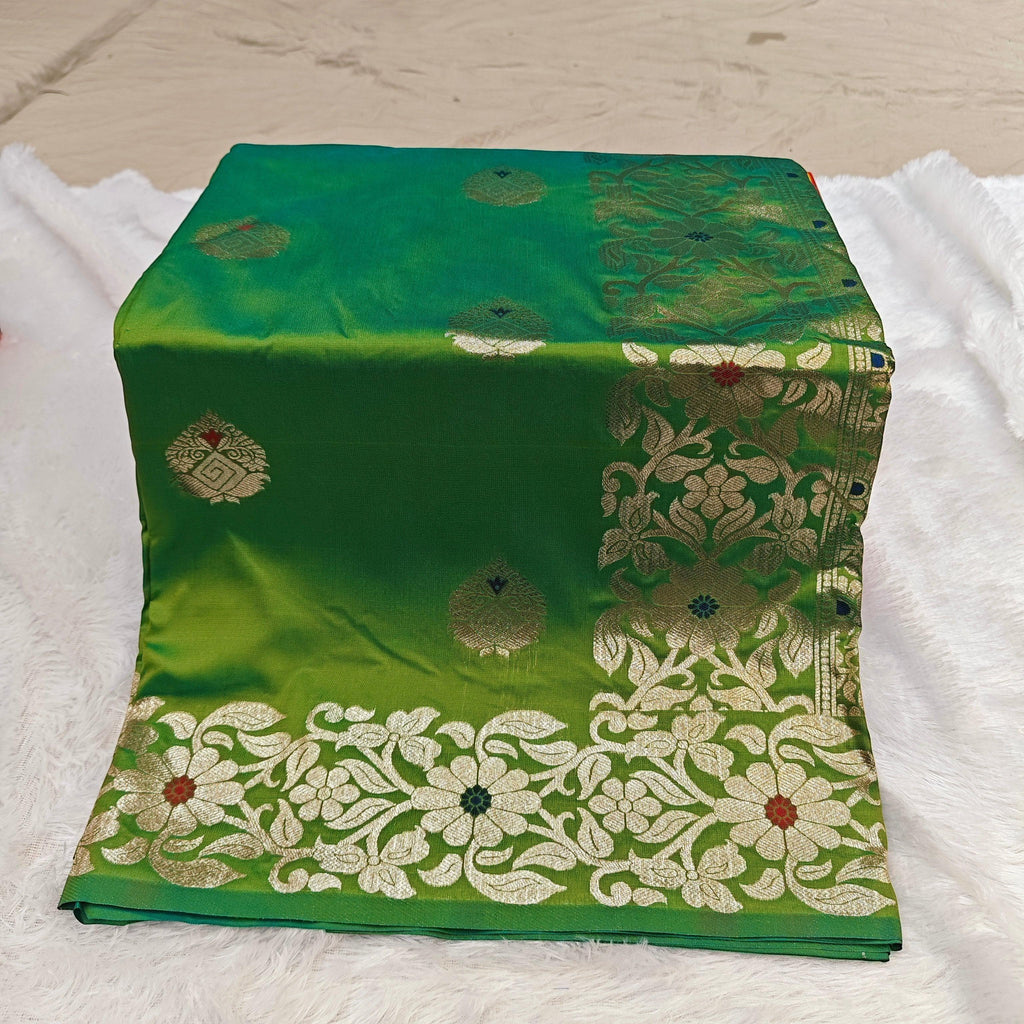 City Center green silk blend saree featuring intricate gold zari floral motifs and colorful Mina weaving details.