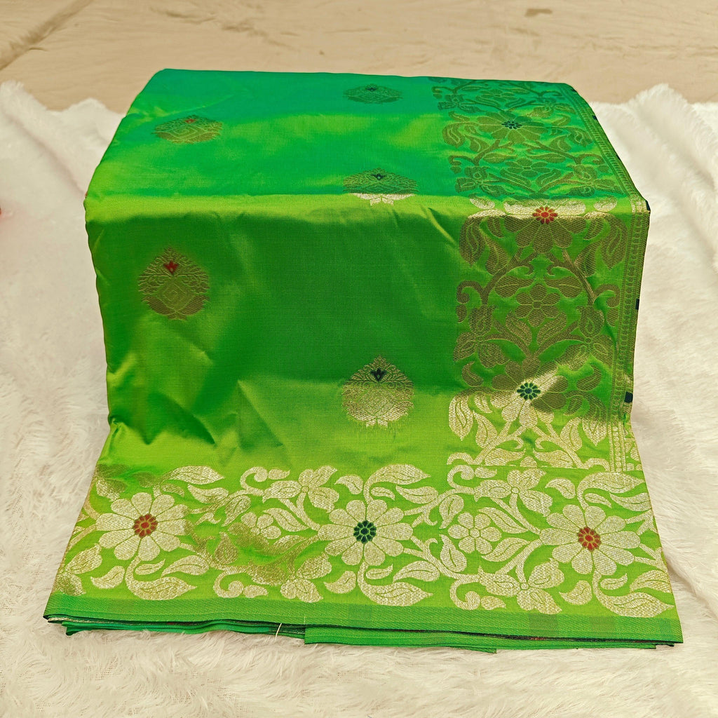 City Center green silk blend Takshashila saree with intricate gold zari and multi-color floral mina weaving