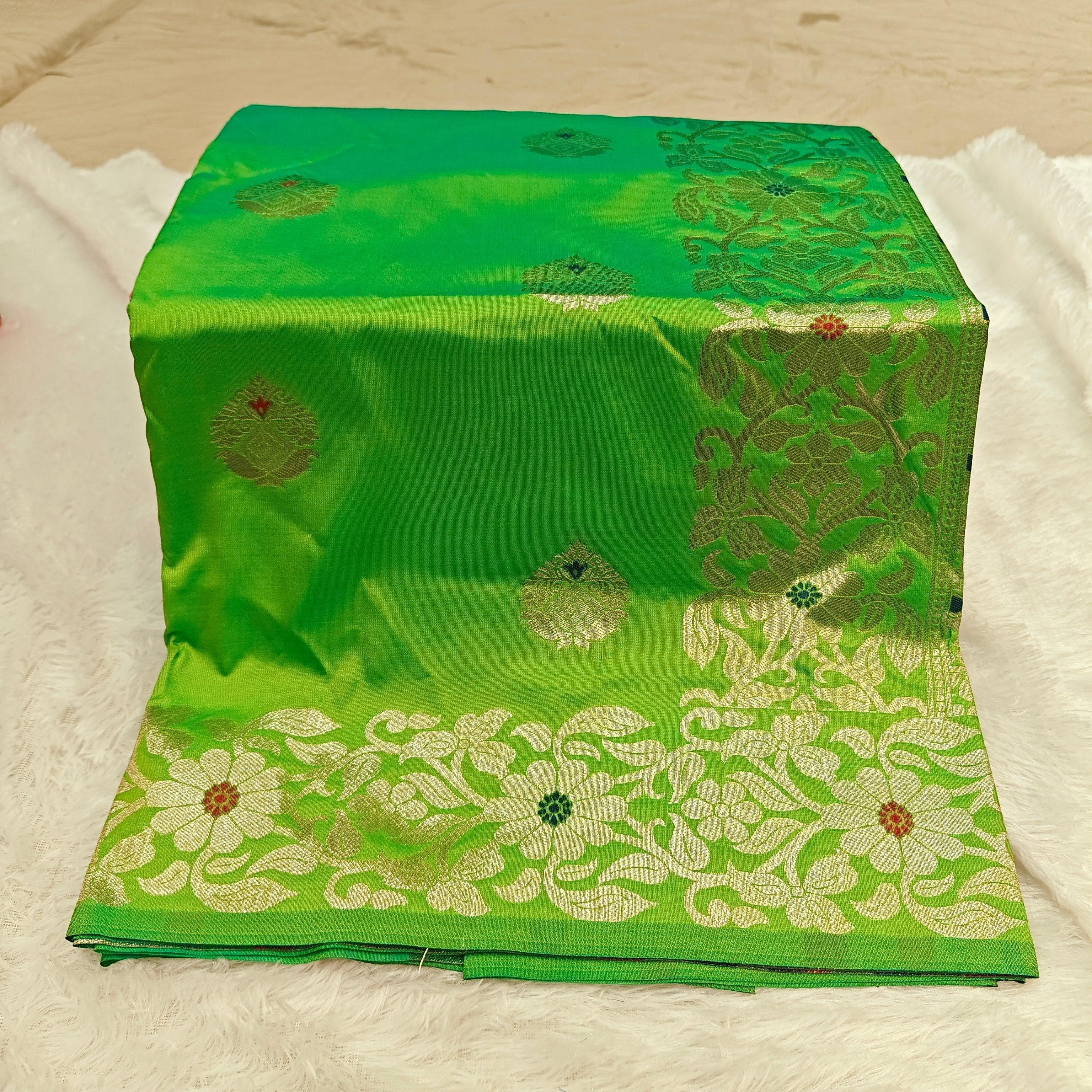 City Center green silk blend Takshashila saree with intricate gold zari and multi-color floral mina weaving