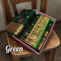 City Center handwoven green mulberry silk Peshwai Paithani saree with intricate gold zari peacock motifs in a box.