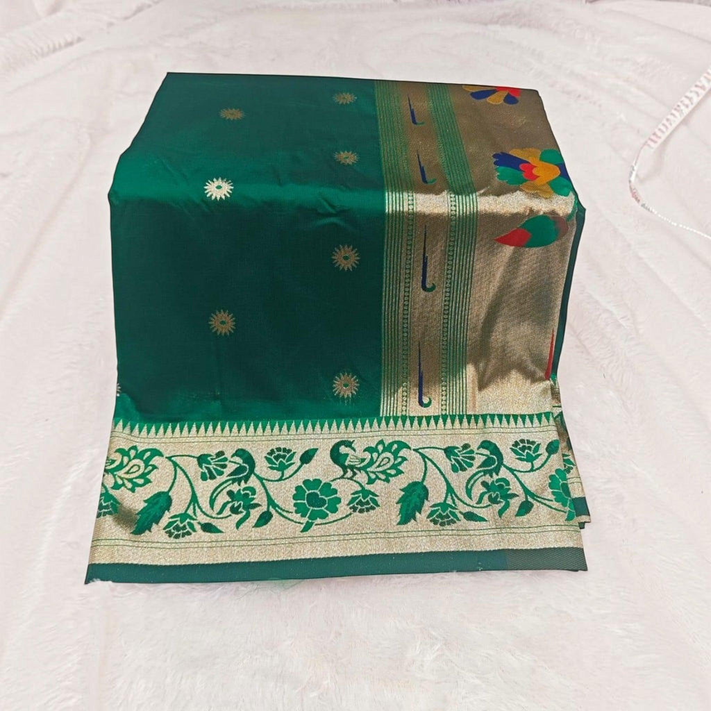 City Center traditional green silk saree with gold floral motifs and an intricate peacock patterned border.