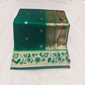 City Center traditional green silk saree with gold floral motifs and an intricate peacock patterned border.