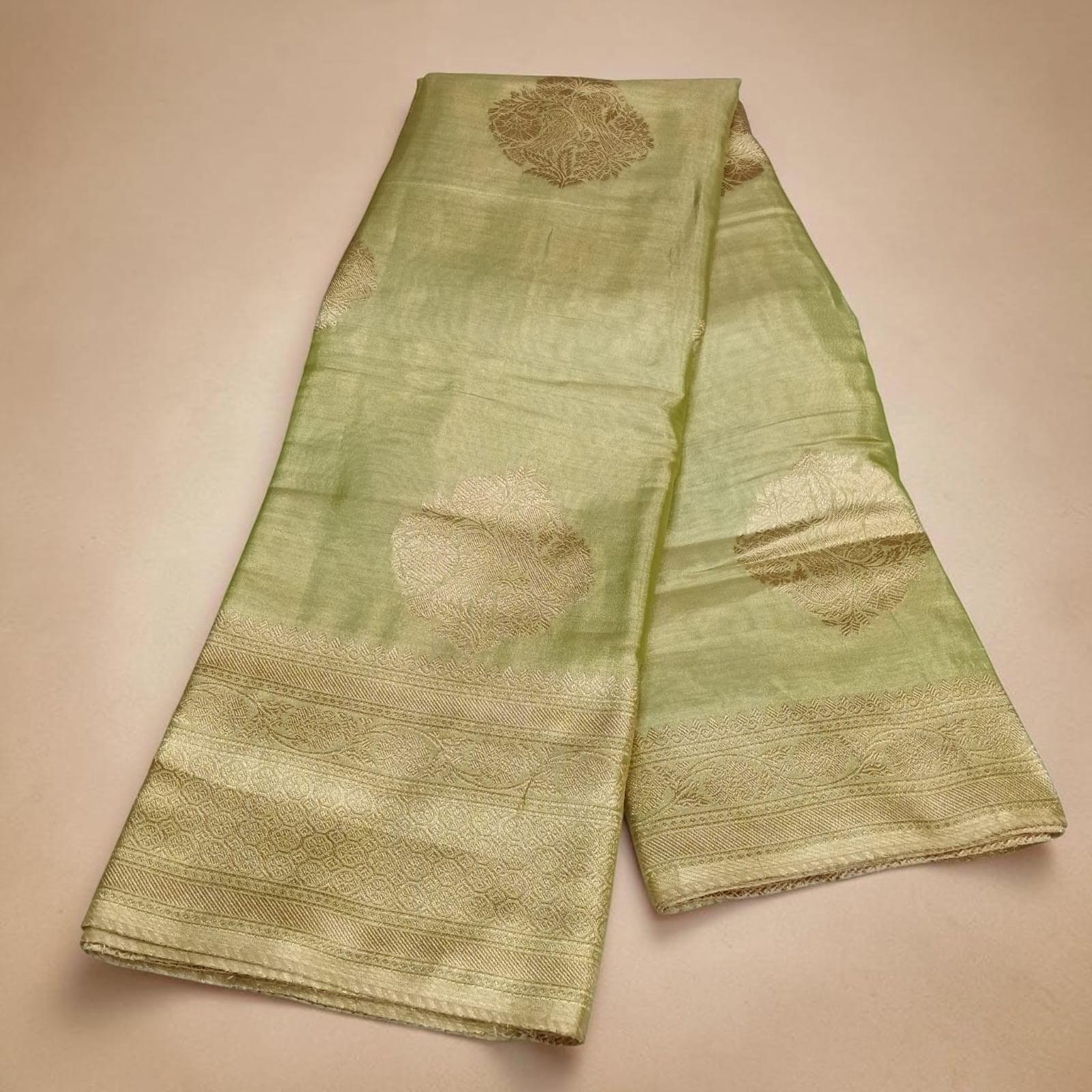 City Center Sankalp tissue saree in light green with gold zari floral motifs and a detailed woven border