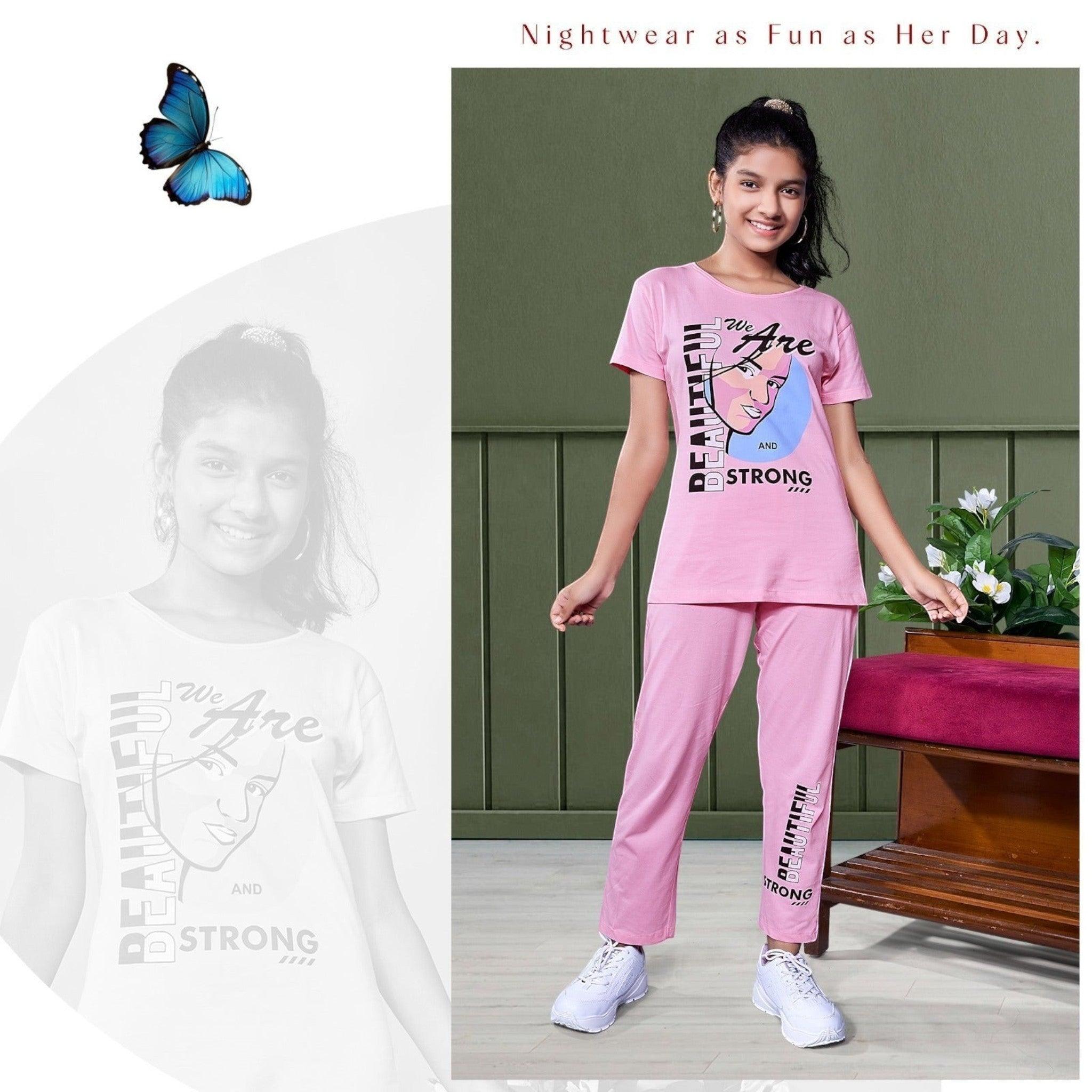 City Center Honey Girls pink loungewear set with graphic print t-shirt and matching trousers on a smiling girl.