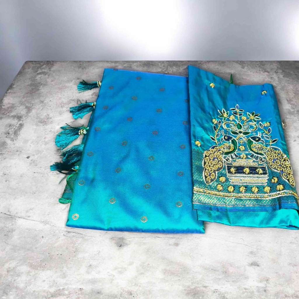 City Center Kalanjali saree with bright blue fabric and intricate peacock aari work embroidery on the blouse