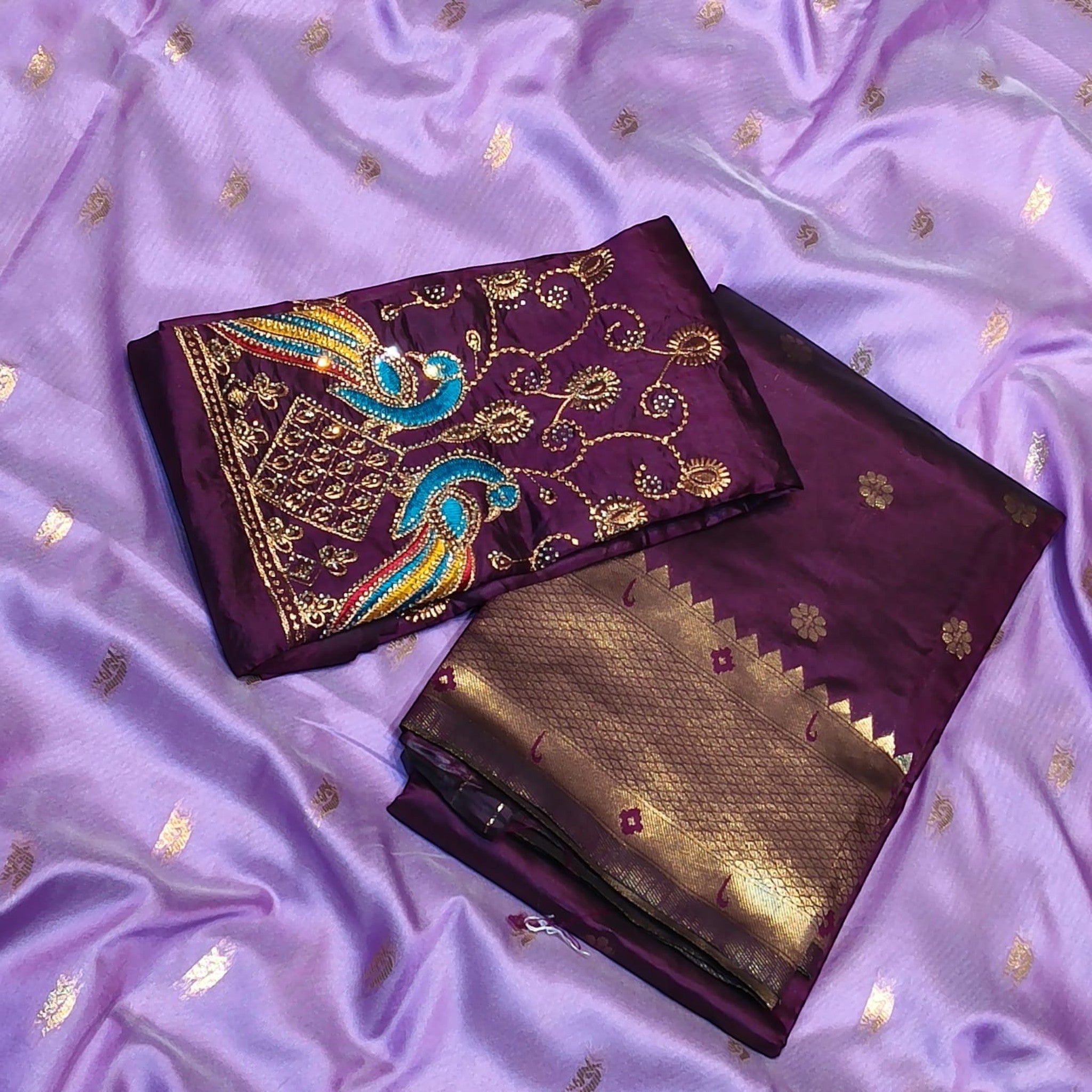 City Center Kalanjali Chandrakala saree in deep purple with intricate peacock Aari embroidery on the matching blouse