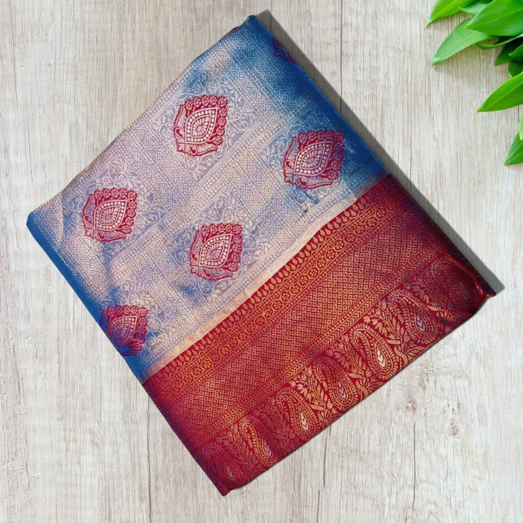 City Center Kanjivaram silk saree featuring a silver-blue body with red zari borders and intricate floral motifs
