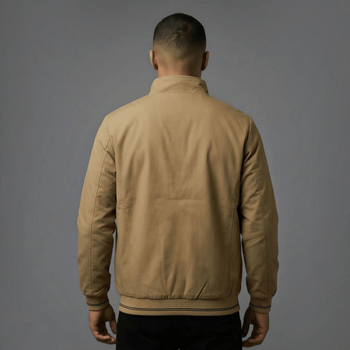 City Center khaki reversible parachute jacket worn by a man, back view showing ribbed hem and professional fit.