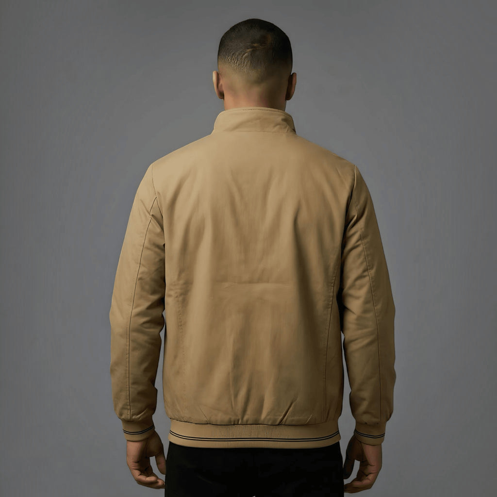 City Center khaki reversible parachute jacket worn by a man, back view showing ribbed cuffs and professional fit.