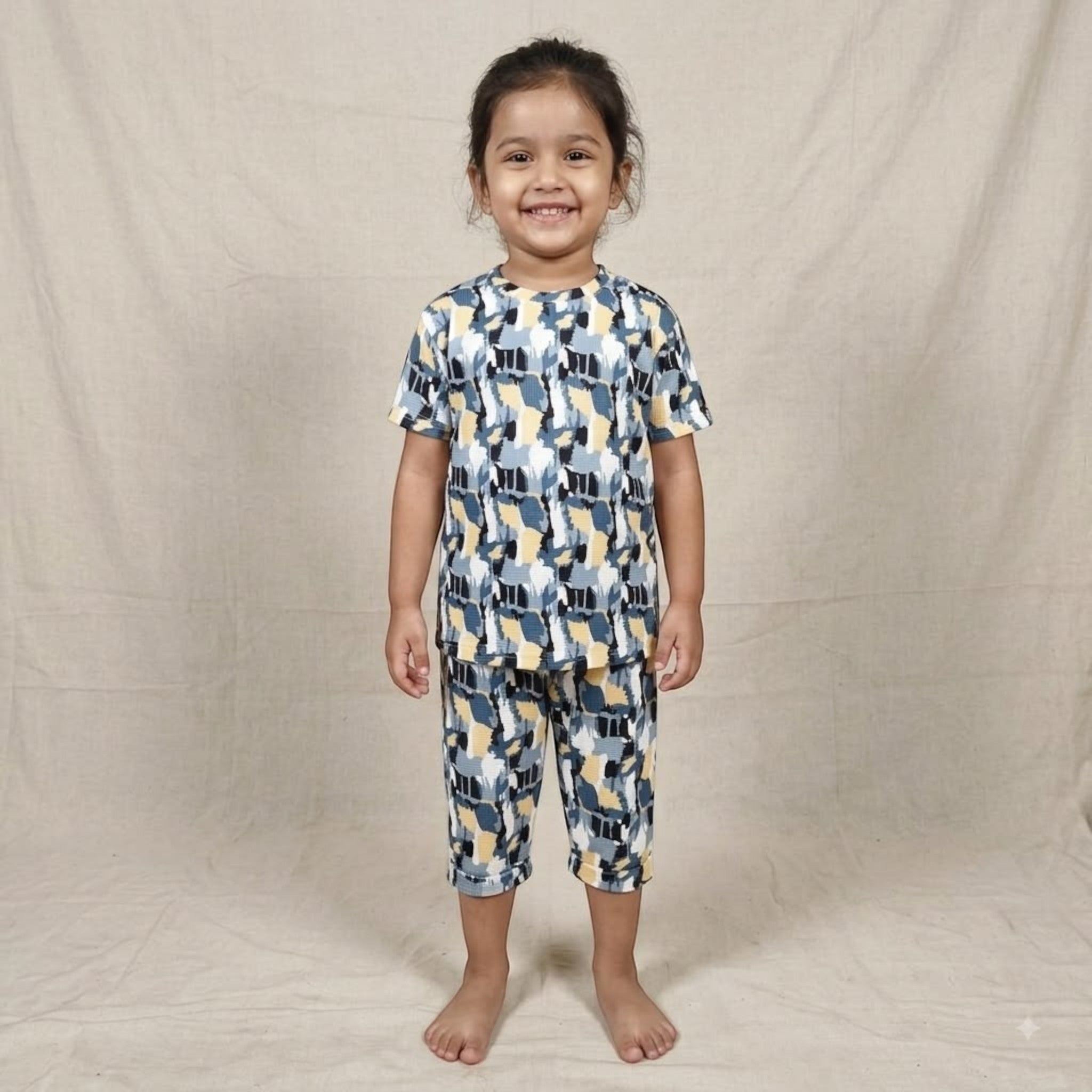 City Center kids co-ord set featuring a short-sleeve top and matching shorts in a vibrant abstract print