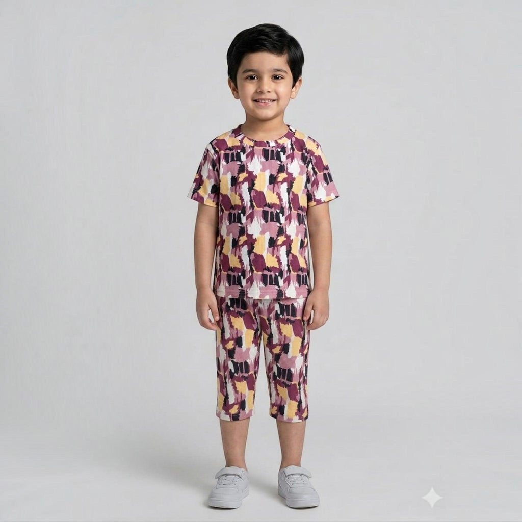 City Center kids cotton co-ord set with a colourful abstract print on a young boy against a plain white background