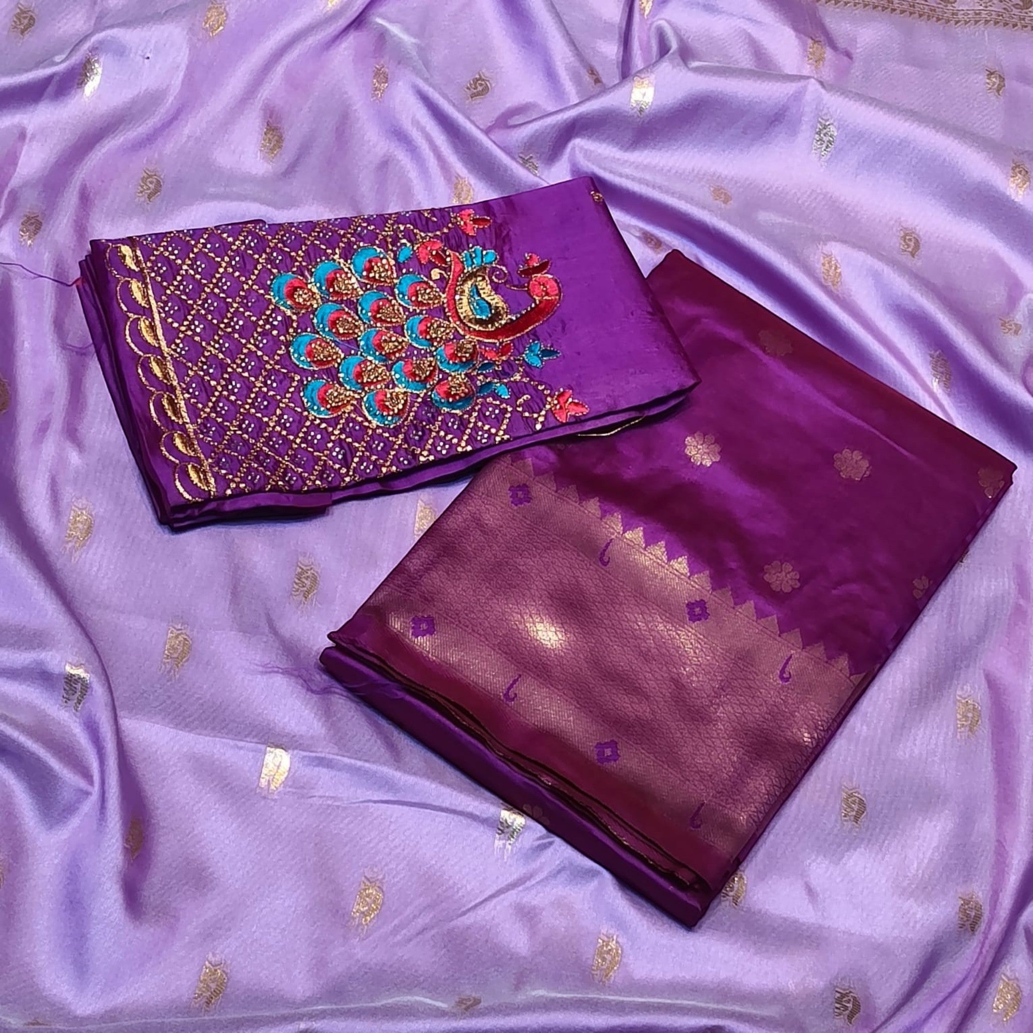 City Center Kalanjali Chandrakala saree in lavender with a deep purple blouse featuring intricate peacock Aari work