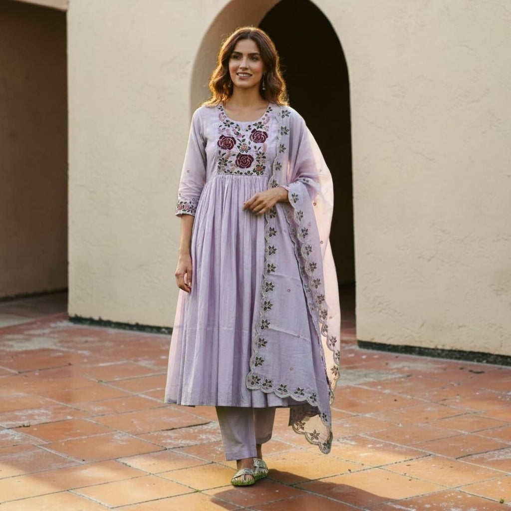 City Center lavender denim kurti with floral embroidery, paired with matching trousers and a sheer dupatta.