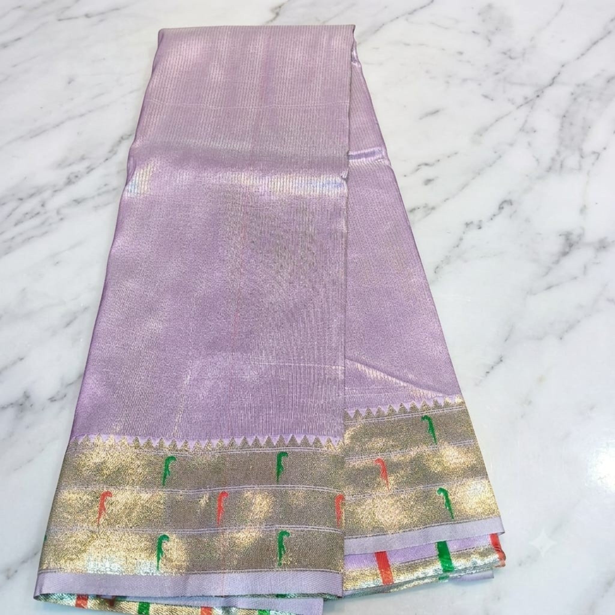 City Center Muniya Paithani silk saree in lavender with a gold zari border featuring traditional parrot motifs.