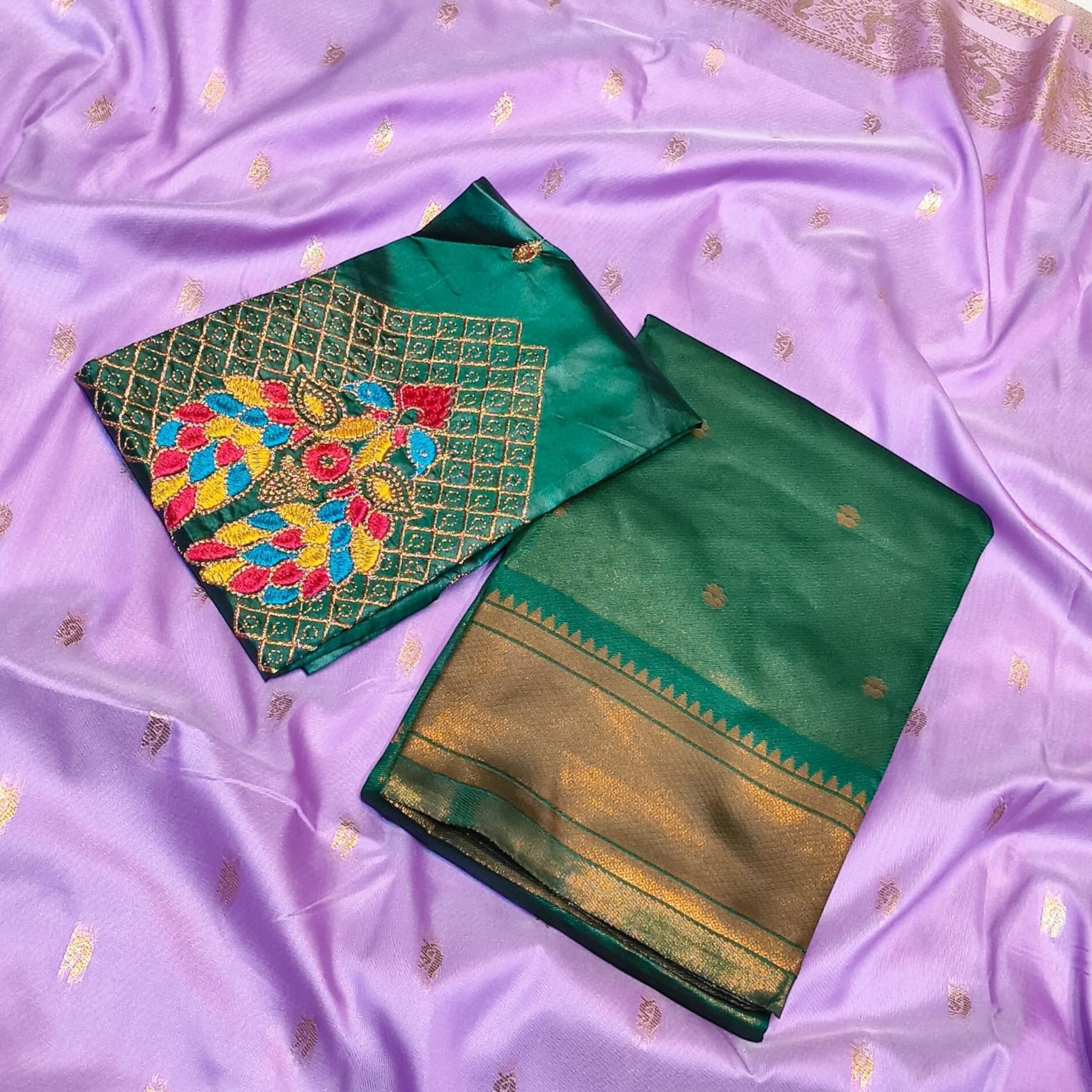 City Center Kalanjali Chandrakala saree in lavender with a green blouse featuring intricate peacock Aari embroidery