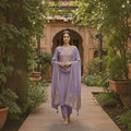 City Center lavender cotton blend kurta set with intricate gold sequins embroidery, worn by a woman in a garden.