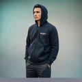 City Center M-LINE black zip-up hoodie worn by a man, featuring a relaxed fit and premium sweatshirt fabric.