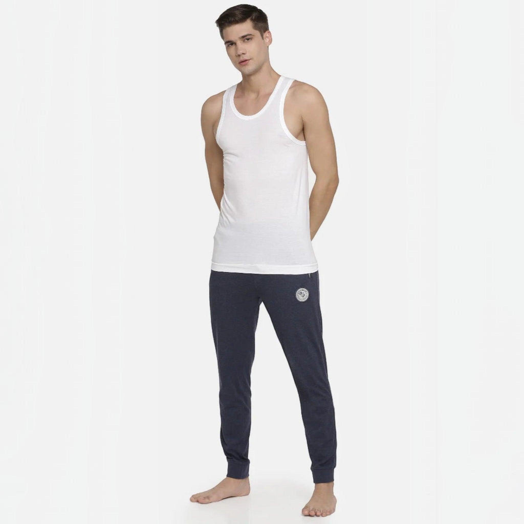 City Center Macroman white seamless cotton vest on a male model with dark blue joggers