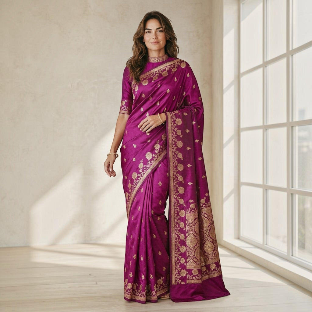 City Center satin silk saree in deep magenta with gold floral embroidery, worn by a woman in a bright studio.