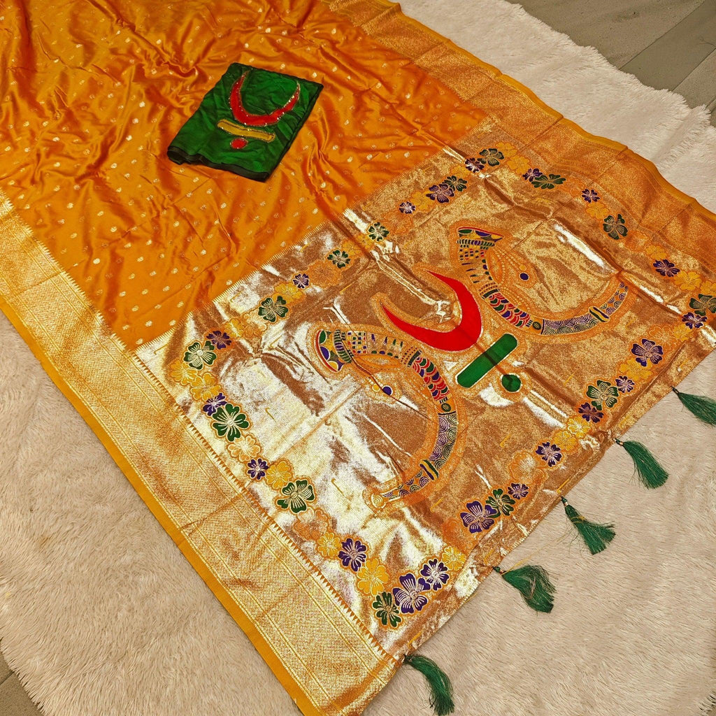 City Center mango silk-blend Rajmata Paithani saree with gold jari weaving, forest green blouse, and crescent moon motifs.