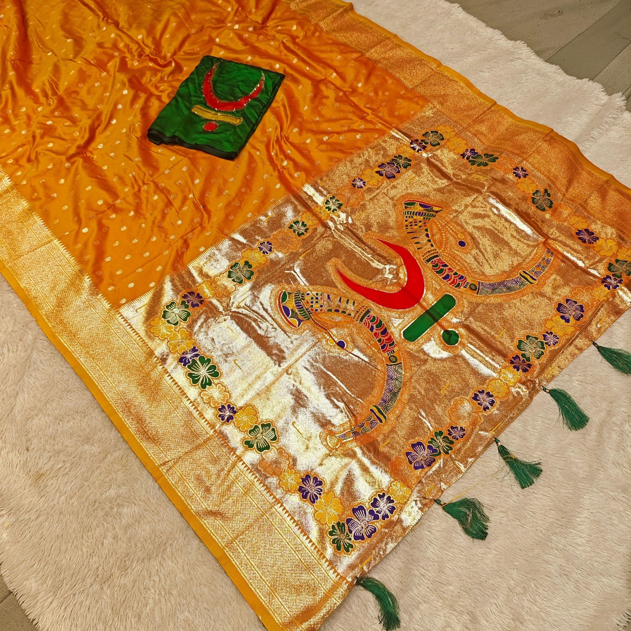 City Center mango silk-blend Rajmata Paithani saree with gold jari weaving, forest green blouse, and crescent moon motifs.
