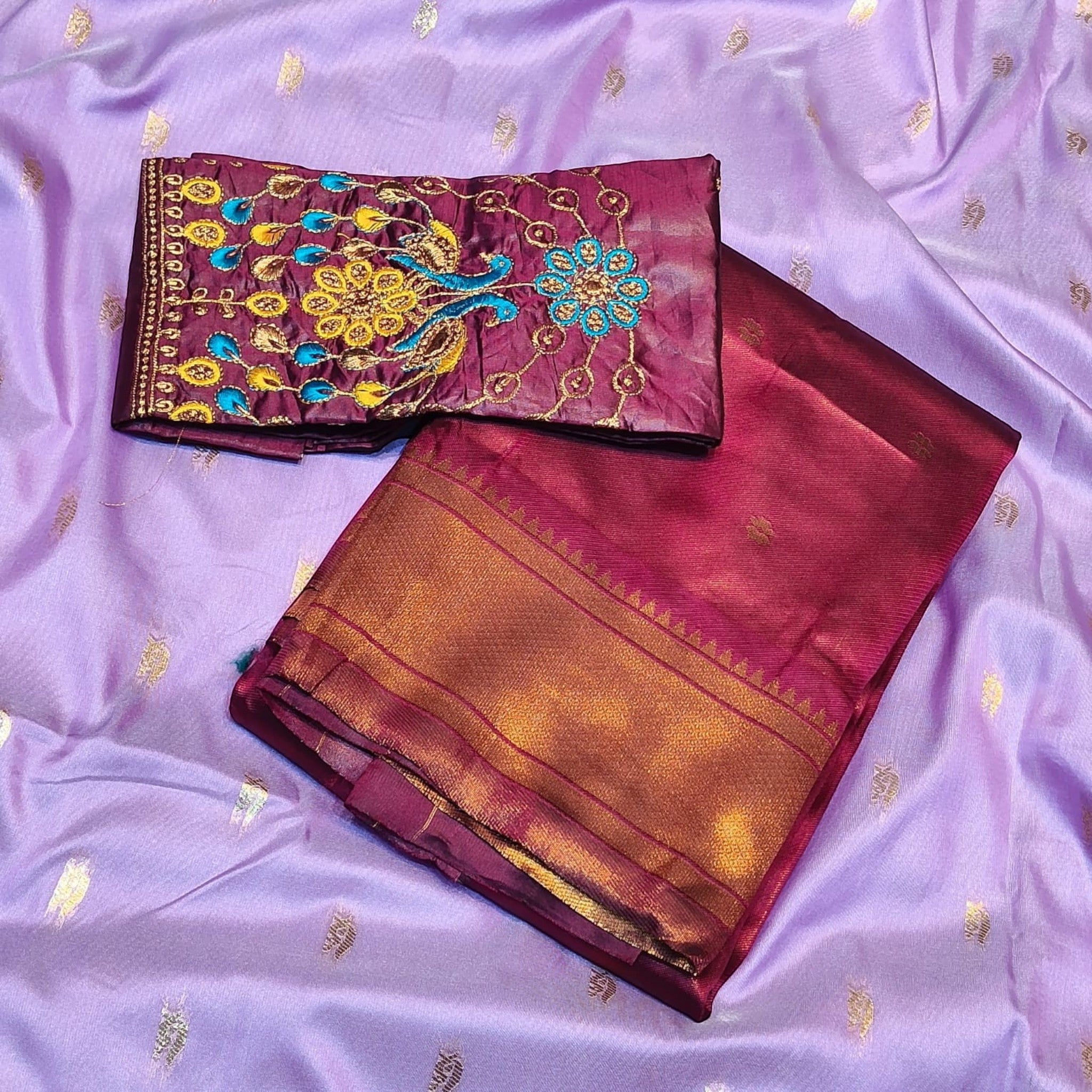 City Center Kalanjali Chandrakala saree in deep maroon with gold border and matching blouse featuring vibrant Aari work