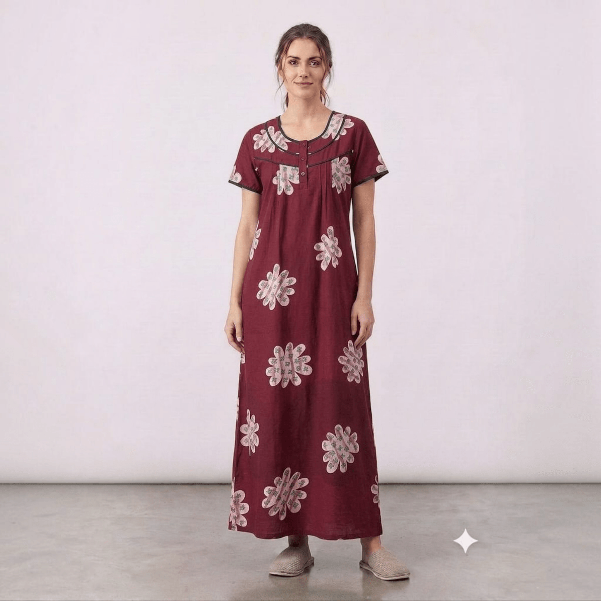 City Center maroon alpine fabric feeding gown with floral print, front pleats, and intricate neck embroidery.