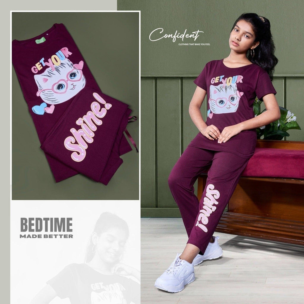 City Center Honey Girls maroon cord set with cat graphic print, short-sleeved top, and matching lounge pants.