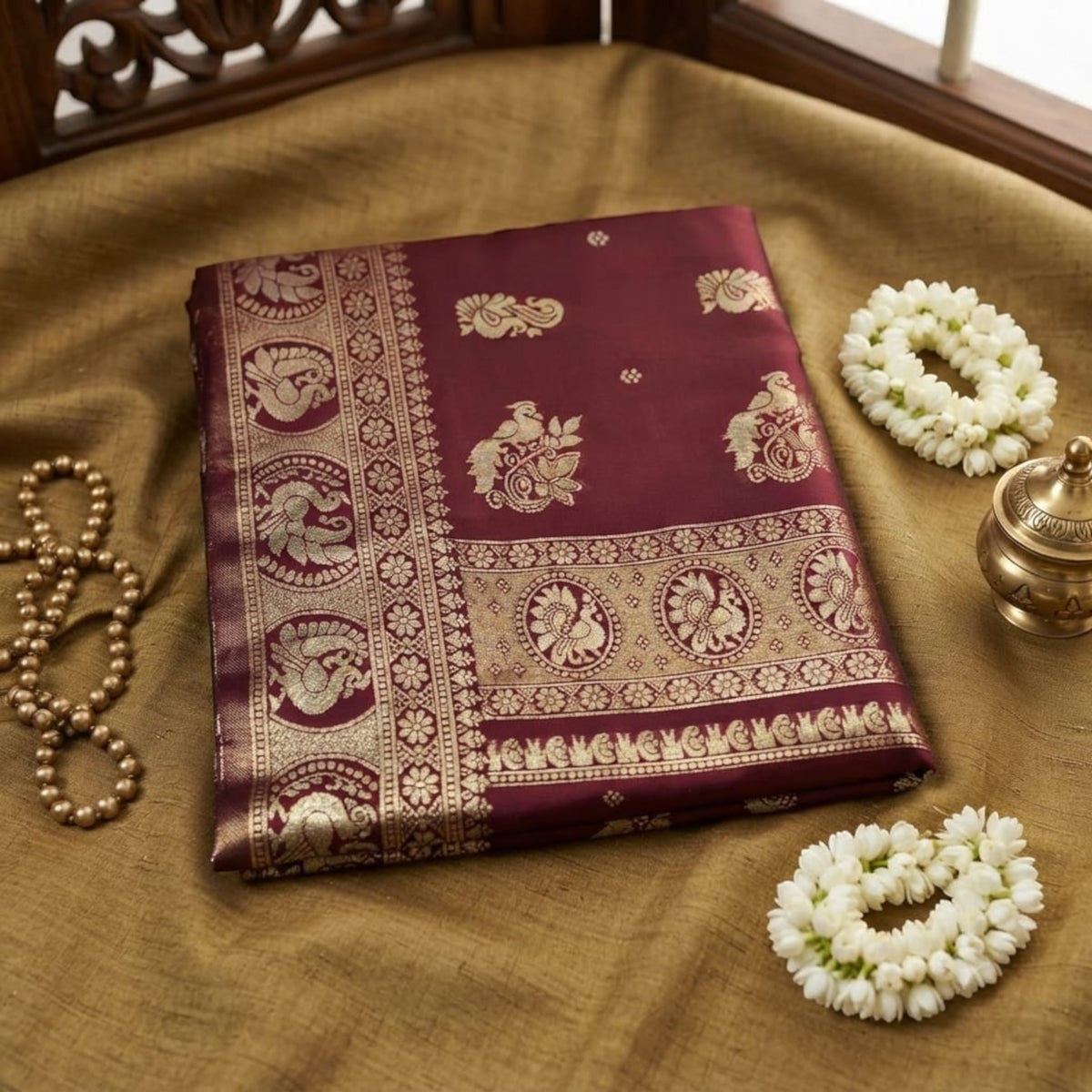 City Center Mayurakshi Paithani saree in deep maroon with intricate gold peacock zari border and motifs