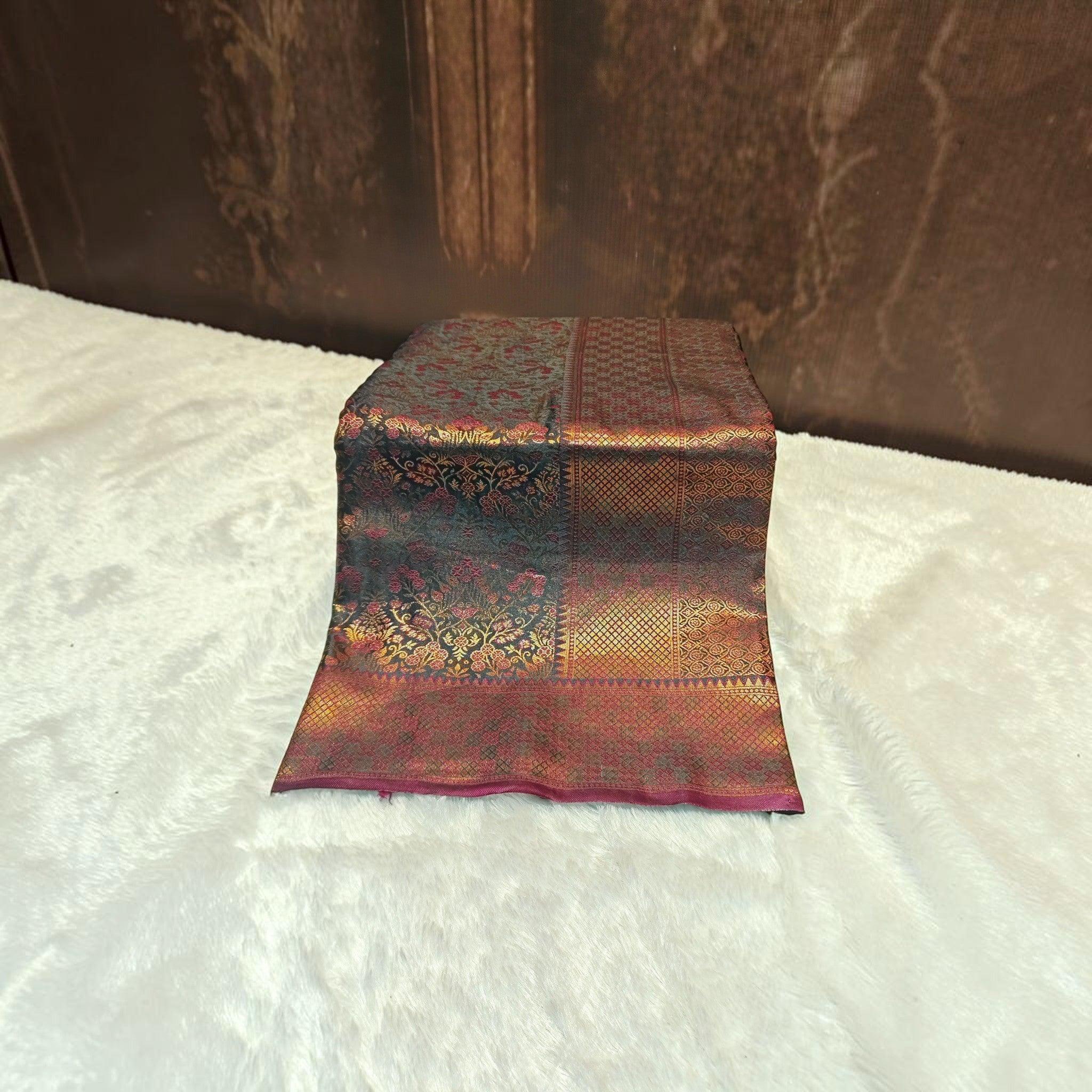 City Center satin silk saree featuring intricate floral and geometric gold zari patterns on a deep maroon fabric.