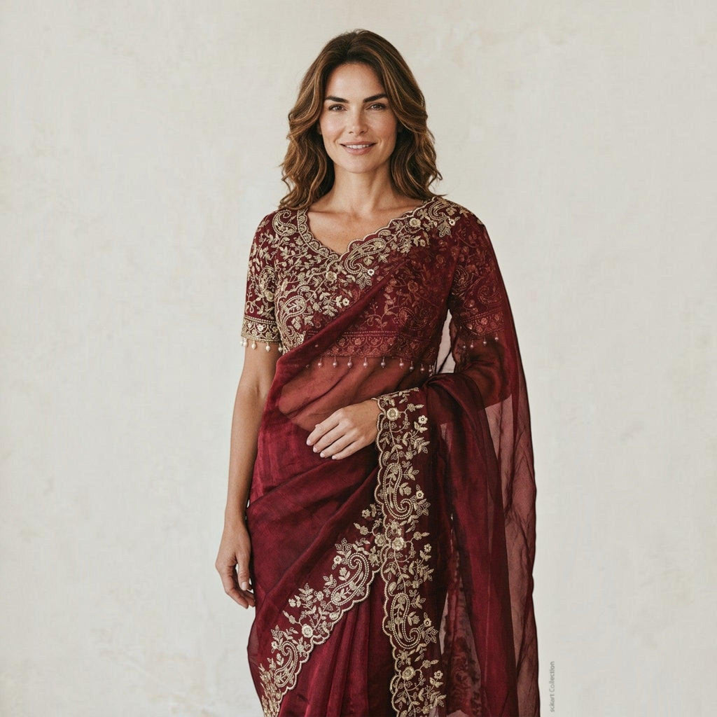 City Center designer maroon shimmer saree with intricate gold embroidery and matching handcrafted blouse on a woman