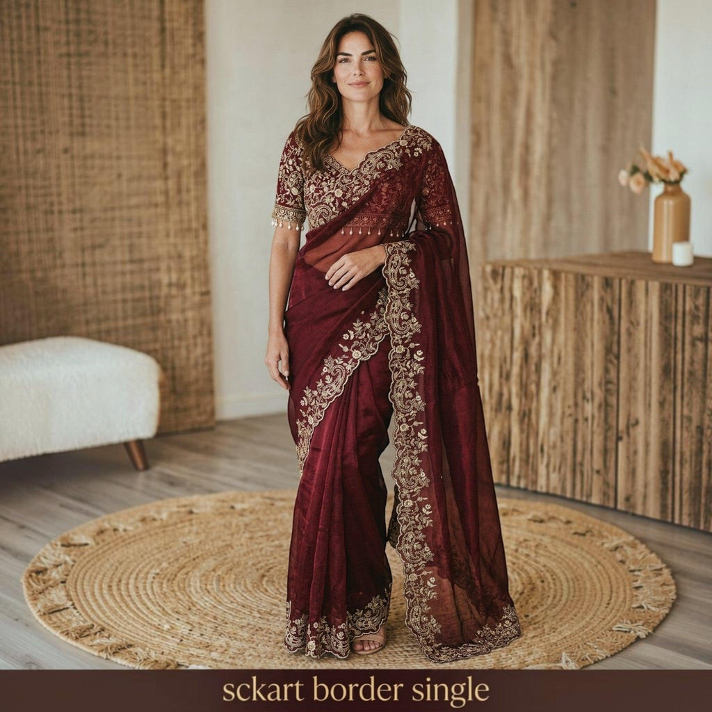 City Center designer maroon shimmer saree with intricate gold embroidery and matching blouse on a woman