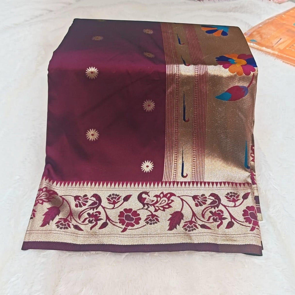 City Center traditional deep maroon silk saree with gold floral motifs and an intricate peacock patterned border