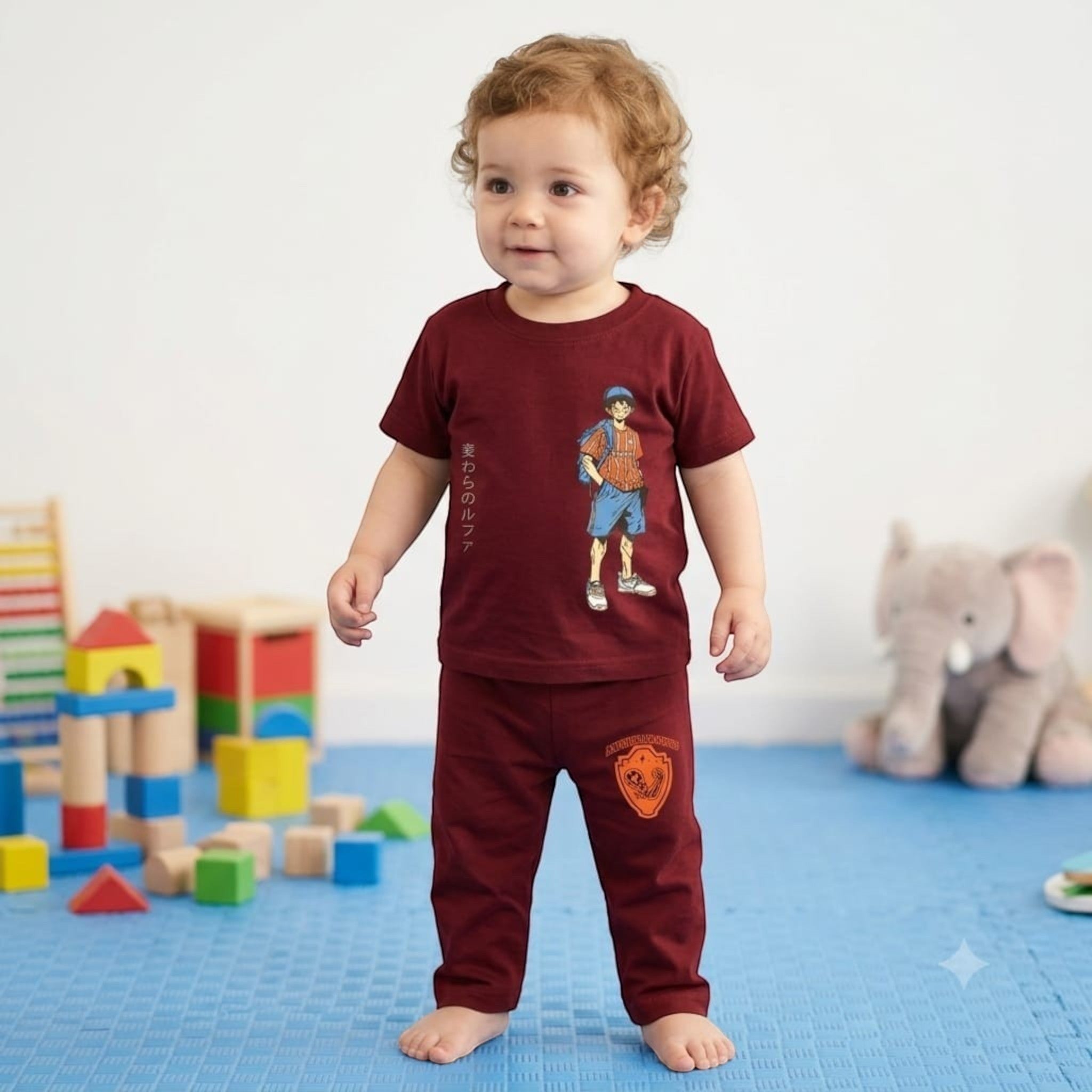 City Center toddler wearing a maroon graphic t-shirt and matching pants lounge set in a playroom.