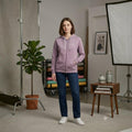 City Center mauve full zip hooded sweatshirt with drawstring, worn by a woman with dark blue jeans and white sneakers.