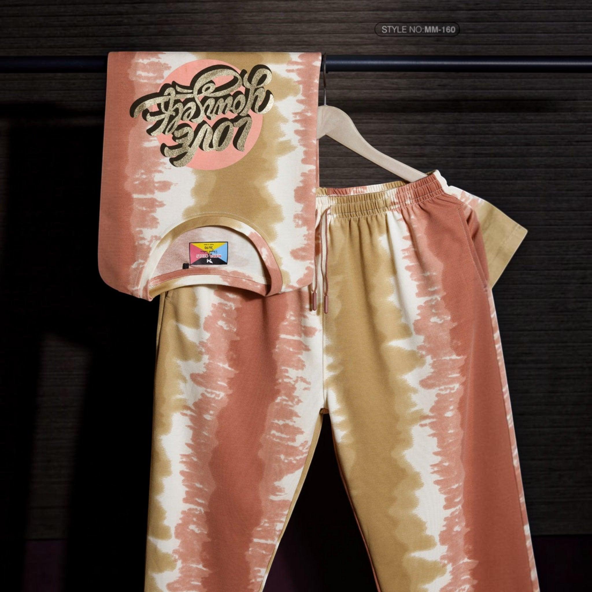City Center Mawa Girl tie-dye cord set featuring a peach and tan patterned top with graphic print and matching pants.