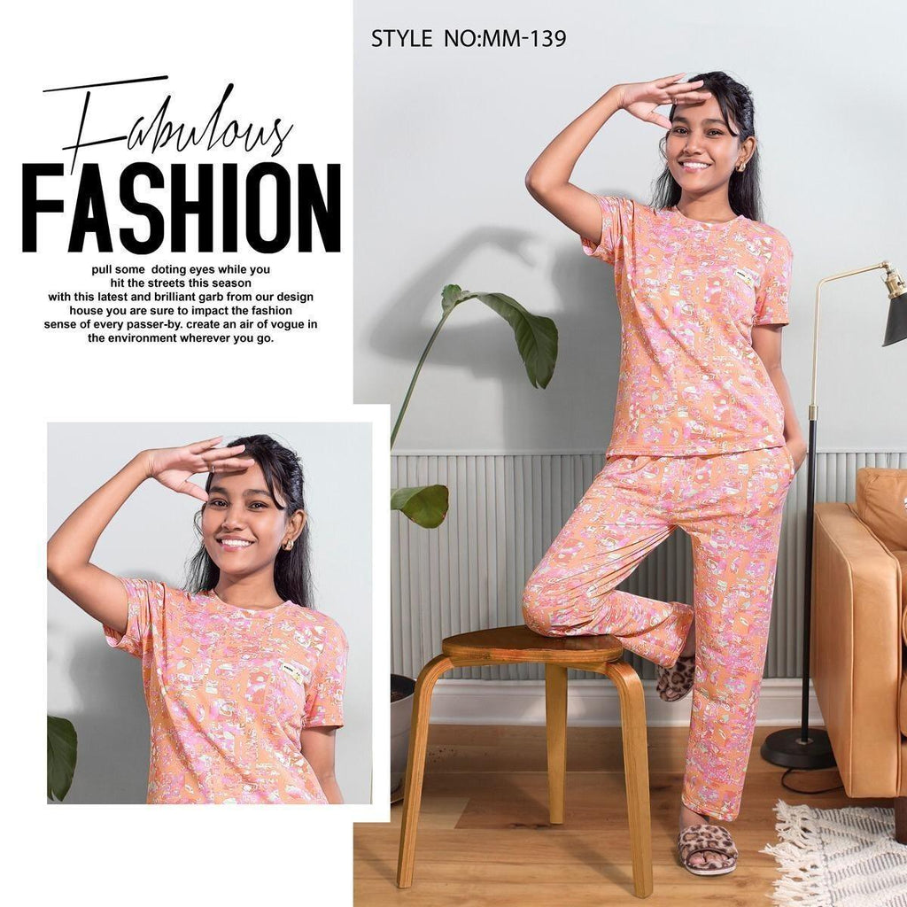 City Center Mawa girls premium peach floral print looper fabric cord set worn by a smiling girl in a modern living room