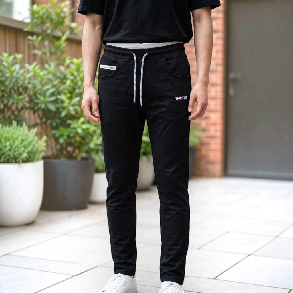 City Center men's black tapered track pants with white drawstring and side pockets worn with a black t-shirt