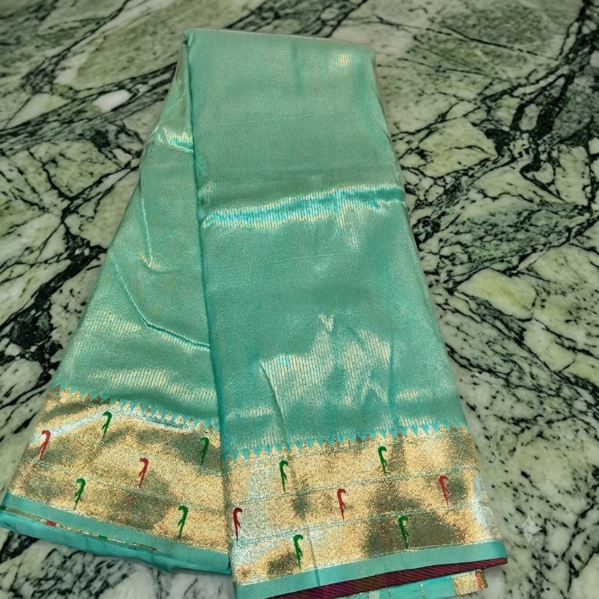 City Center Muniya Paithani silk saree in mint green with gold zari border and traditional parrot motifs