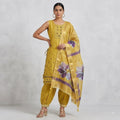 City Center mustard yellow Afghani shalwar kurti with floral dupatta and intricate embroidery on a model