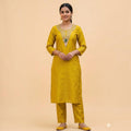 City Center mustard yellow vertical textured co-ord set with embroidered neckline and matching trousers on a model