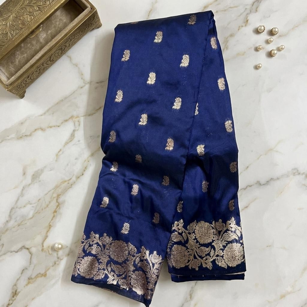 City Center premium navy blue Kattpadar silk saree with intricate gold zari floral motifs and a wide ornate border.