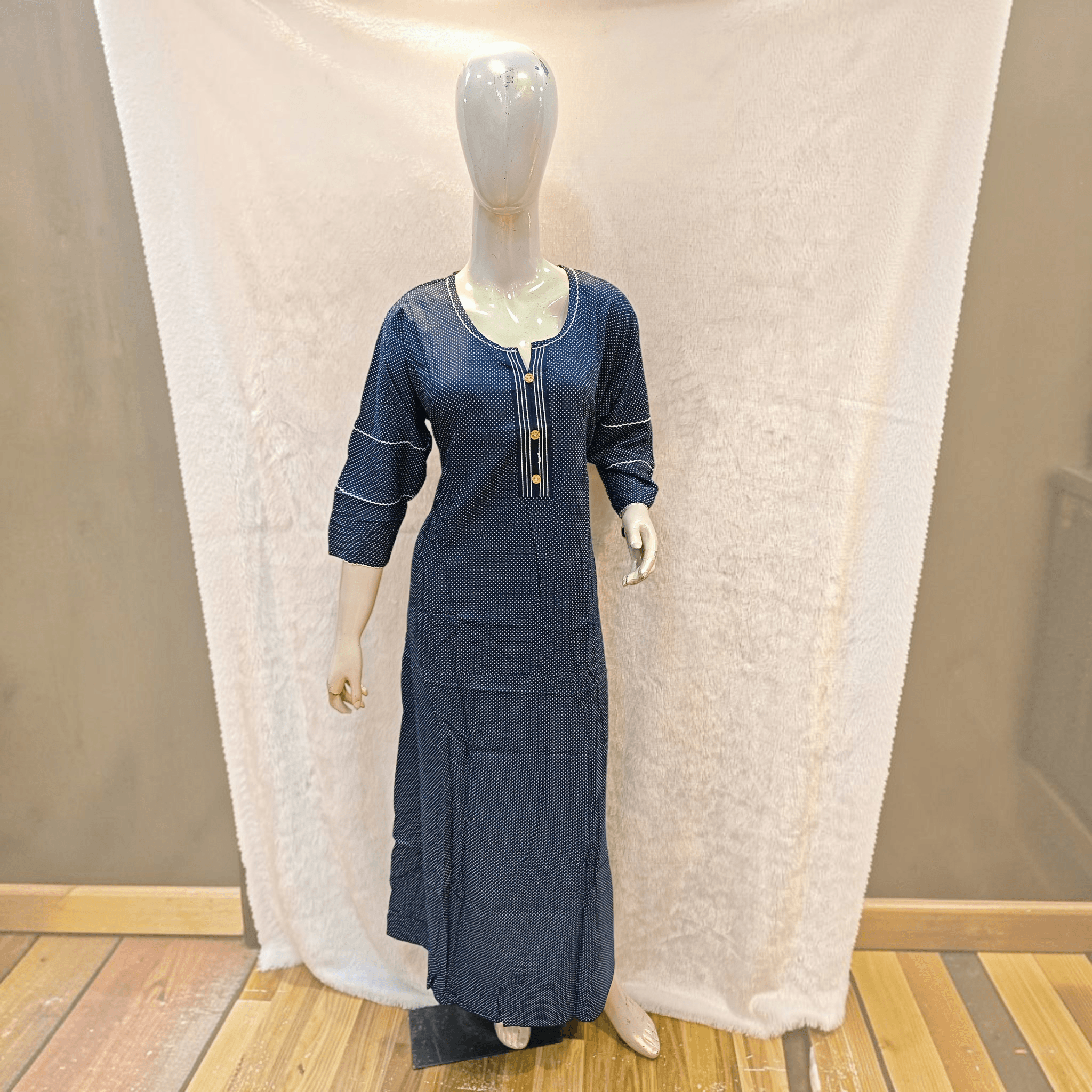 City Center heavy rayon A-line gown in navy blue with white polka dots, three-quarter sleeves, and button-down detail.