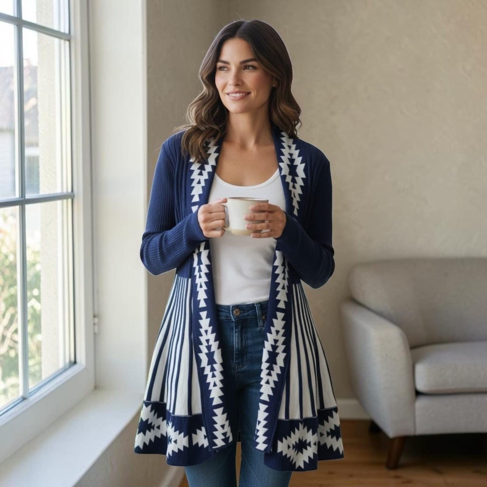 City Center long open front knit cardigan in navy blue with white geometric patterns, worn by a woman indoors.