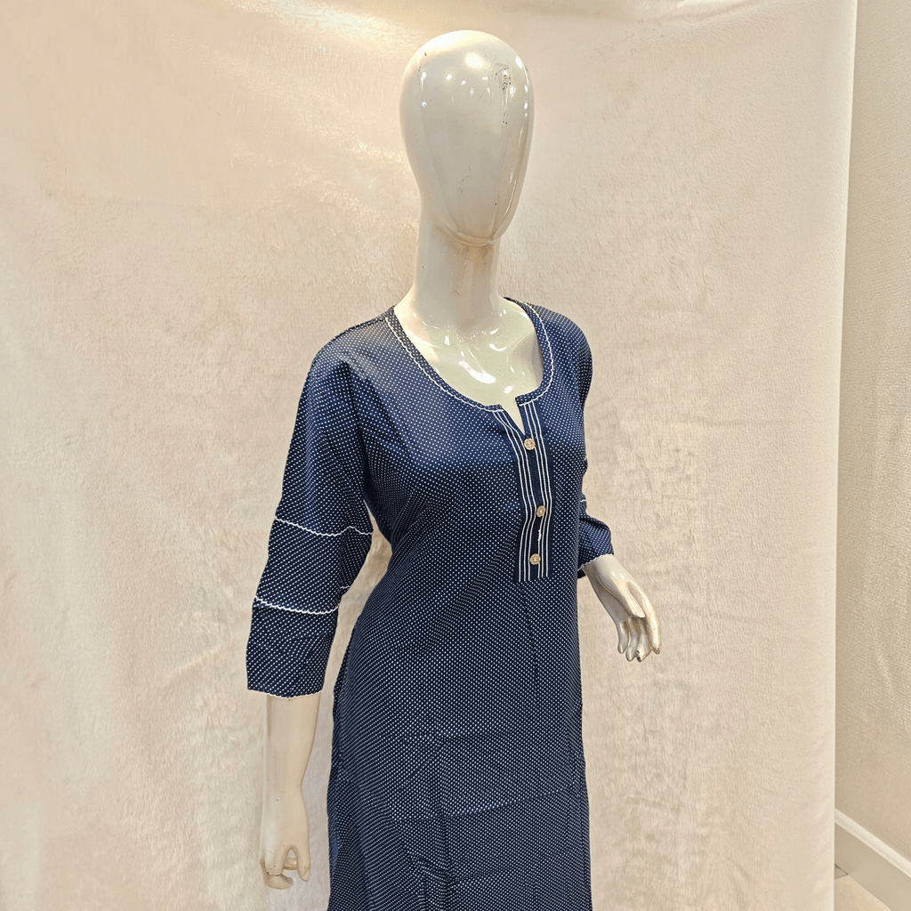 City Center navy blue polka dot A-line rayon gown with three-quarter sleeves and button detail on a mannequin