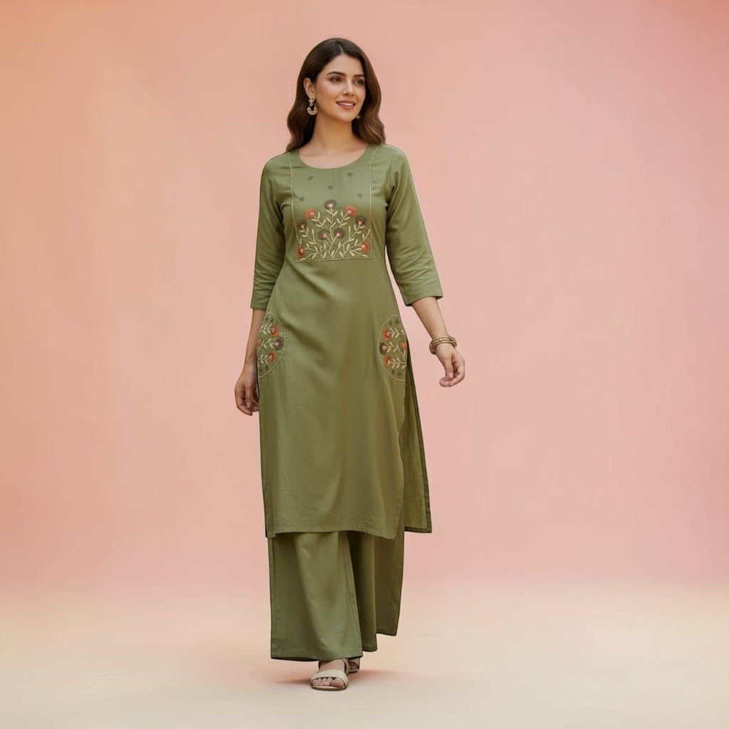 City Center olive green embroidered kurta and wide-leg palazzo set worn by a woman on a soft pink background.