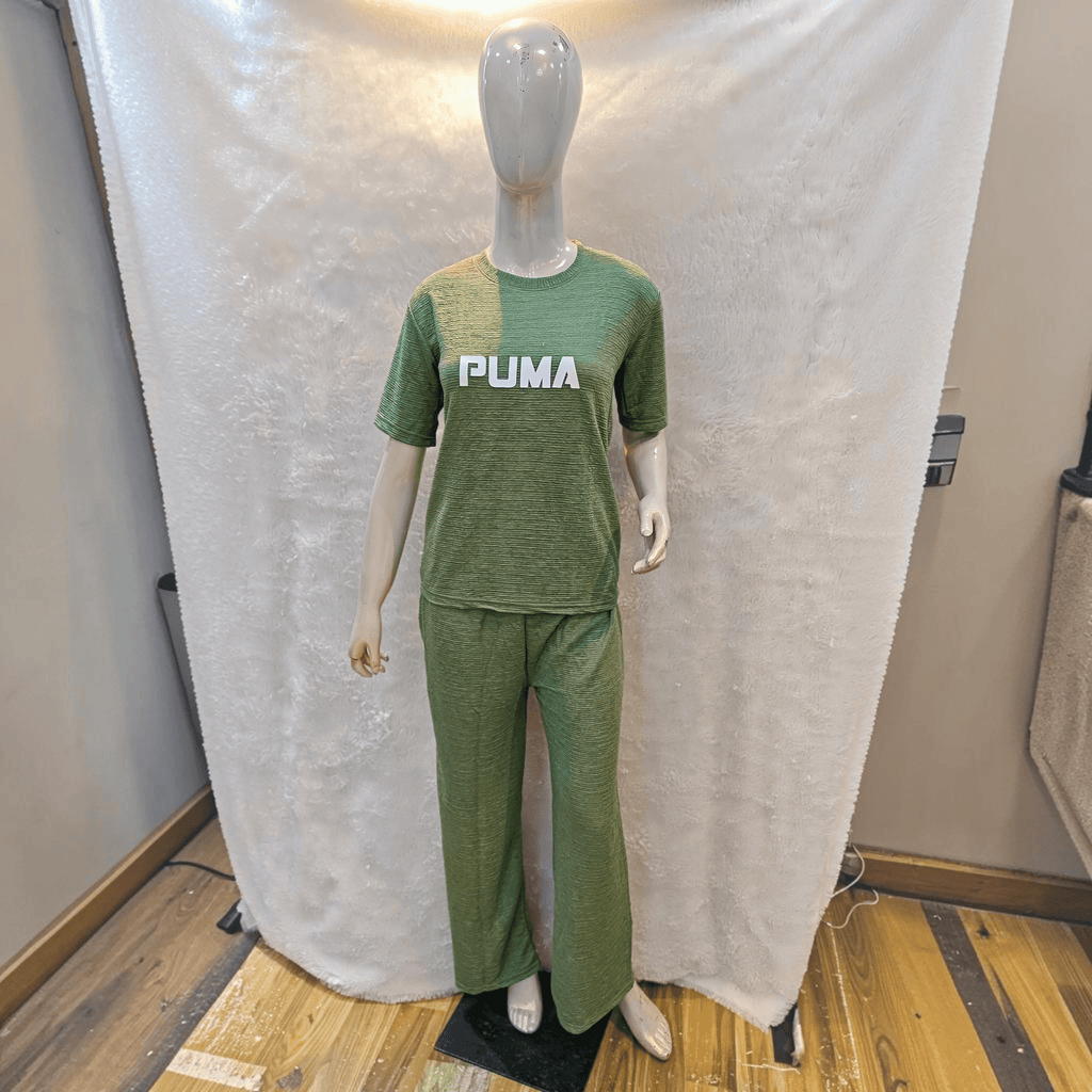 City Center olive green Korean airport cord set with short sleeves and relaxed fit trousers on a mannequin