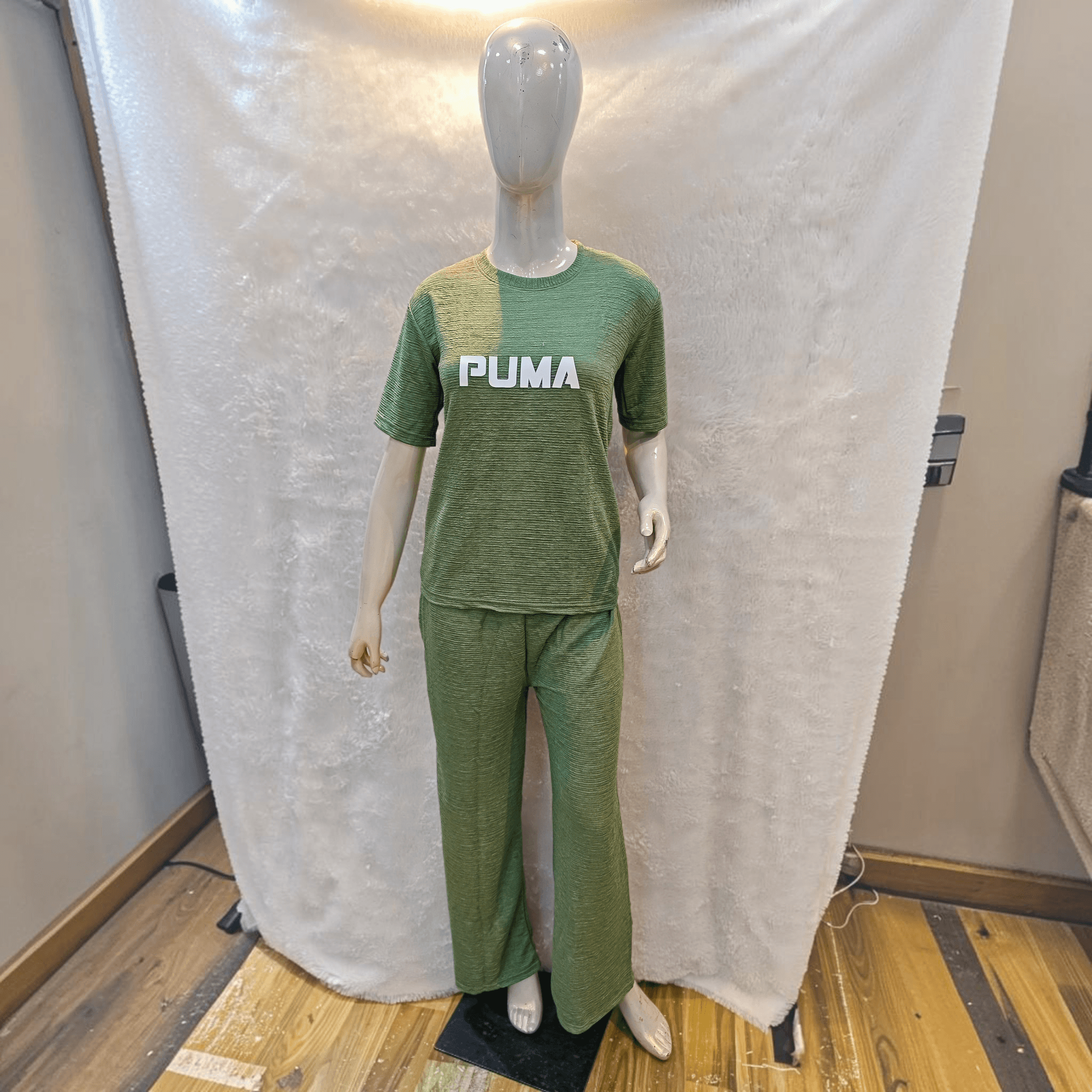 City Center olive green Korean airport cord set with short sleeves and relaxed fit trousers on a mannequin