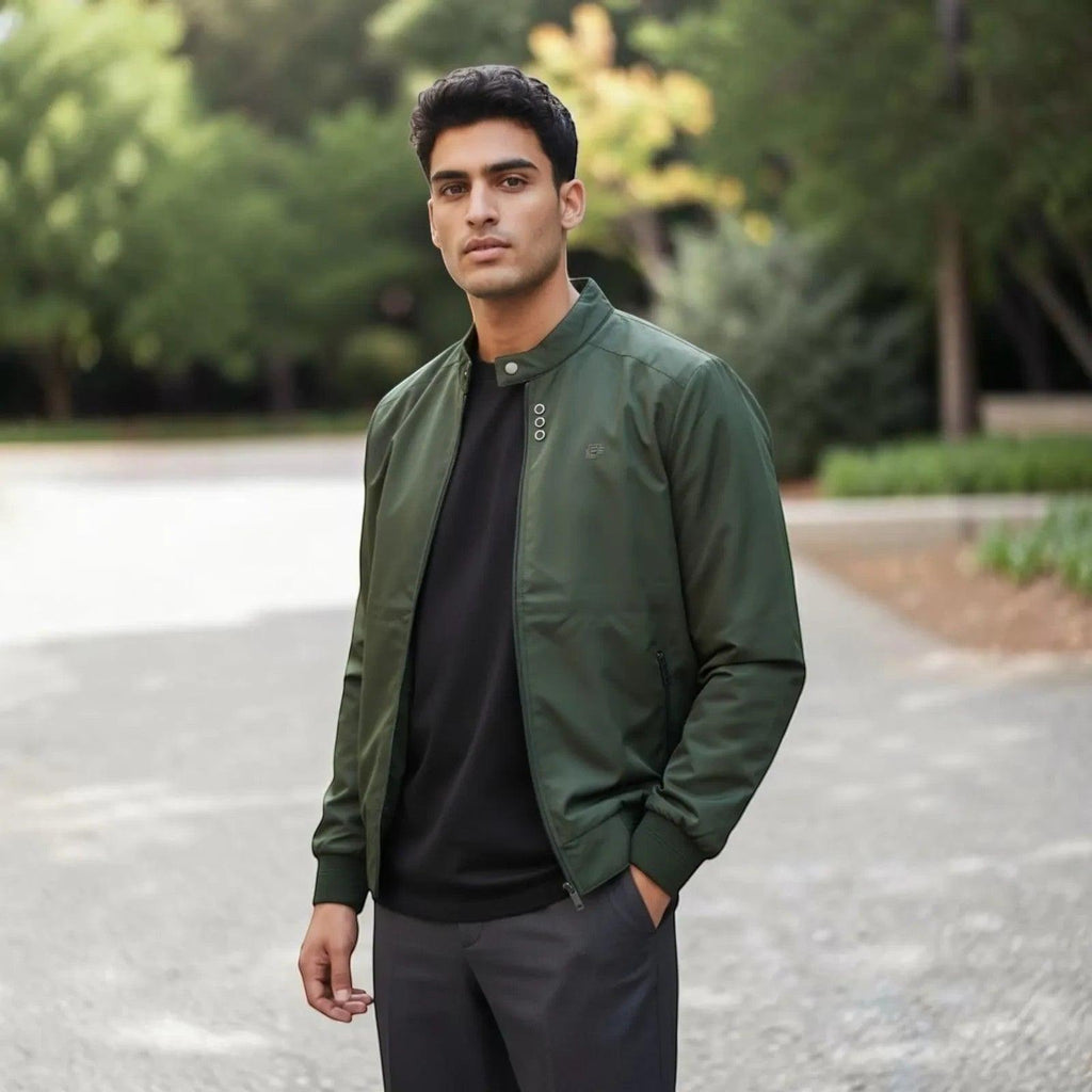 City Center olive green full-zip casual jacket worn by a man with a black t-shirt and grey trousers in a park setting