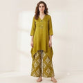 City Center olive green co-ord set featuring a V-neck tunic with metallic accents and patterned wide-leg trousers.